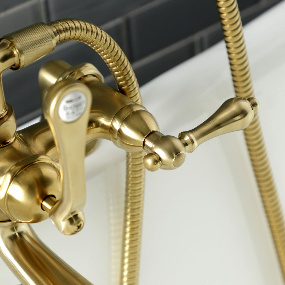 Aqua Vintage AE203T7 Three-Handle 2-Hole Deck Mount Clawfoot Tub Faucet with Hand Shower, Brushed Brass