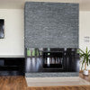 Cosmic black ledger panel 6"x24" splitface marble wall tile LPNLMCOSBLK624 product shot angle view