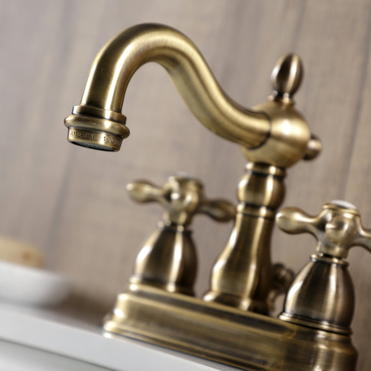 Heritage KB1603AX Two-Handle 3-Hole Deck Mount 4" Centerset Bathroom Faucet with Plastic Pop-Up, Antique Brass