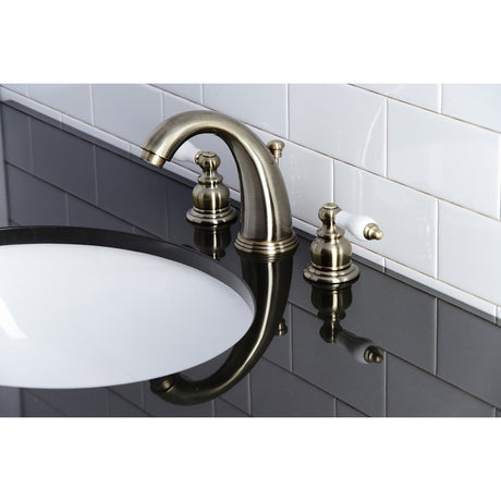 Victorian KB983PLAB Two-Handle 3-Hole Deck Mount Widespread Bathroom Faucet with Plastic Pop-Up, Antique Brass