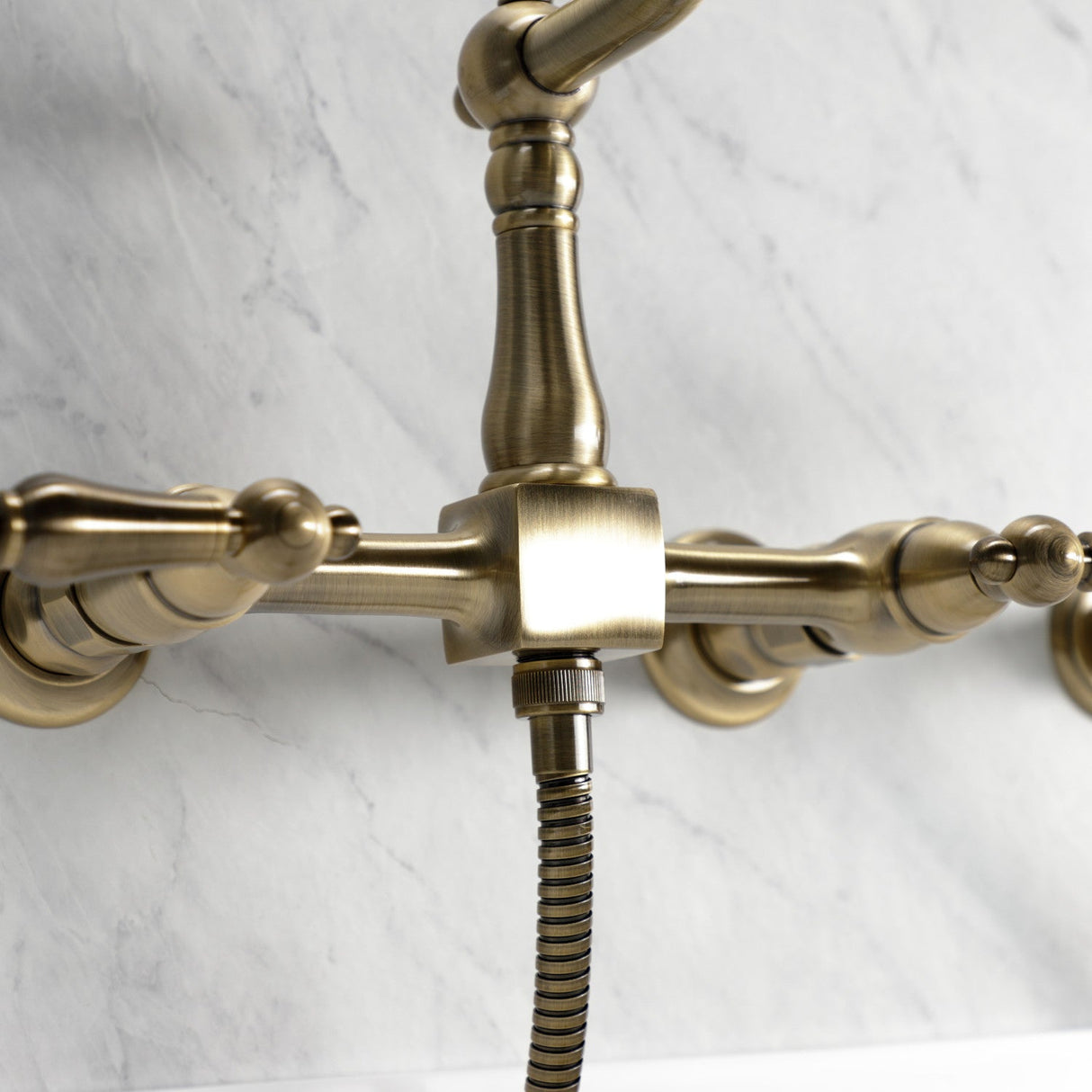 Heritage KS1243ALBS Two-Handle 2-Hole Wall Mount Bridge Kitchen Faucet with Brass Sprayer, Antique Brass