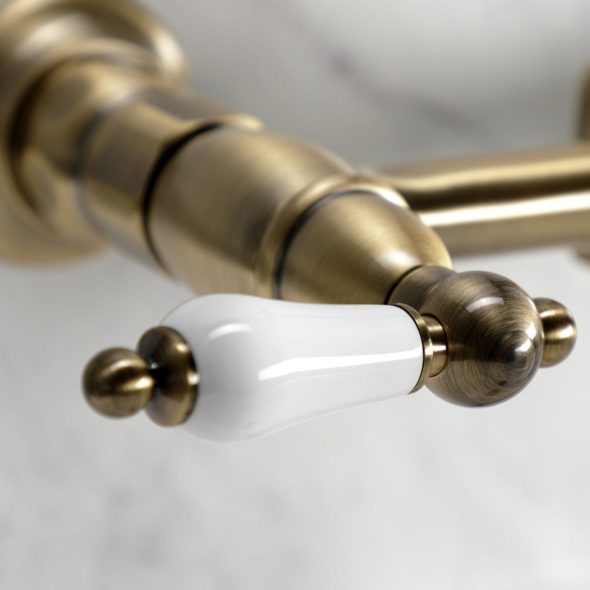 Heritage KS1243PLBS Two-Handle 2-Hole Wall Mount Bridge Kitchen Faucet with Brass Sprayer, Antique Brass