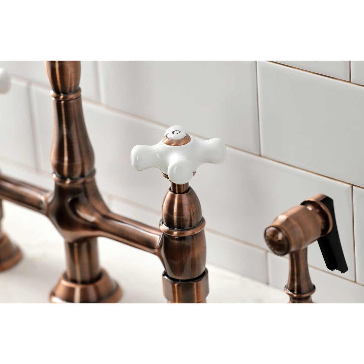 Heritage KS127PXBSAC Two-Handle 4-Hole Deck Mount Bridge Kitchen Faucet with Brass Sprayer, Antique Copper