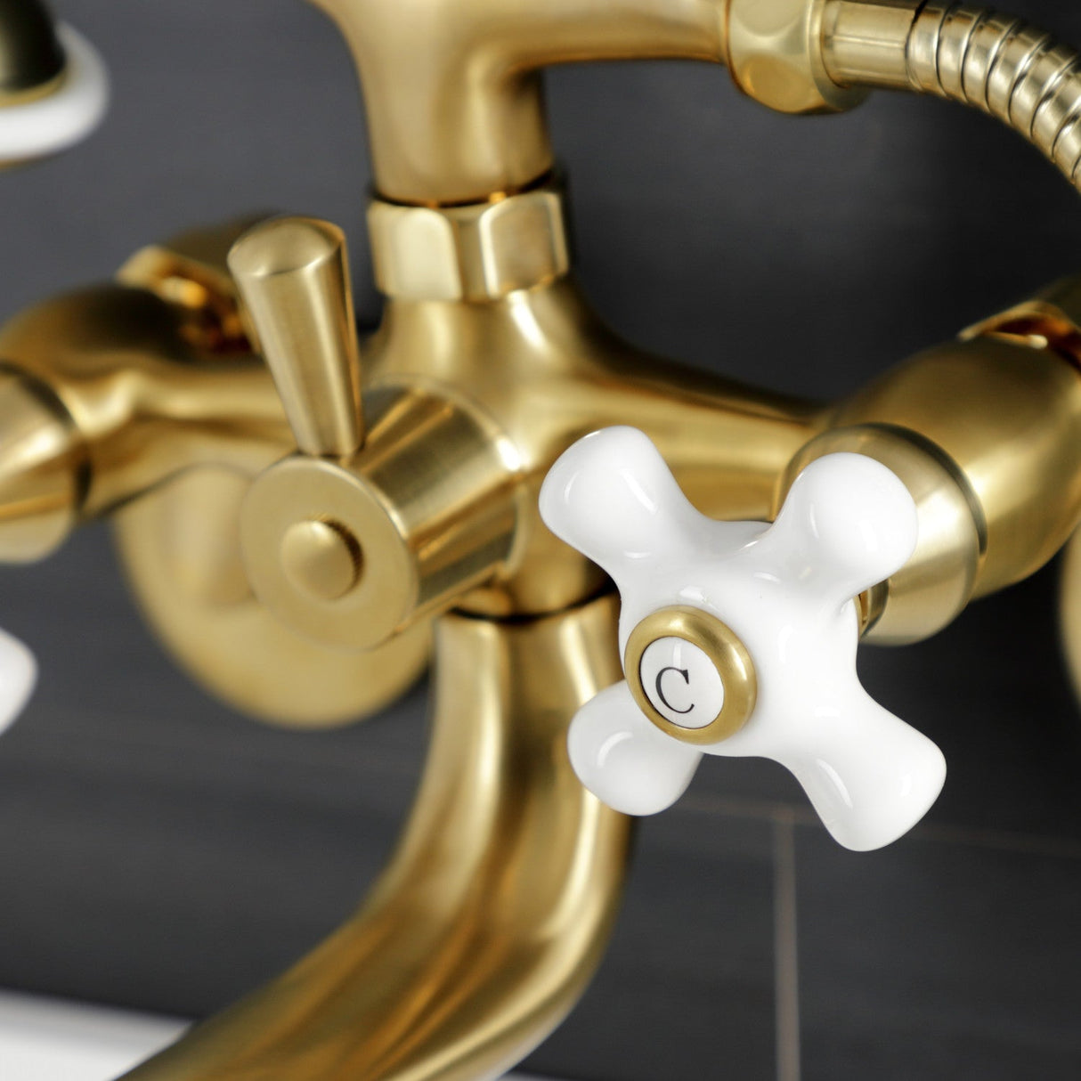 Kingston KS226PXSB Three-Handle 2-Hole Wall Mount Clawfoot Tub Faucet with Hand Shower, Brushed Brass