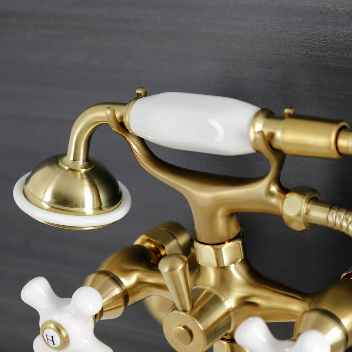 Kingston KS226PXSB Three-Handle 2-Hole Wall Mount Clawfoot Tub Faucet with Hand Shower, Brushed Brass
