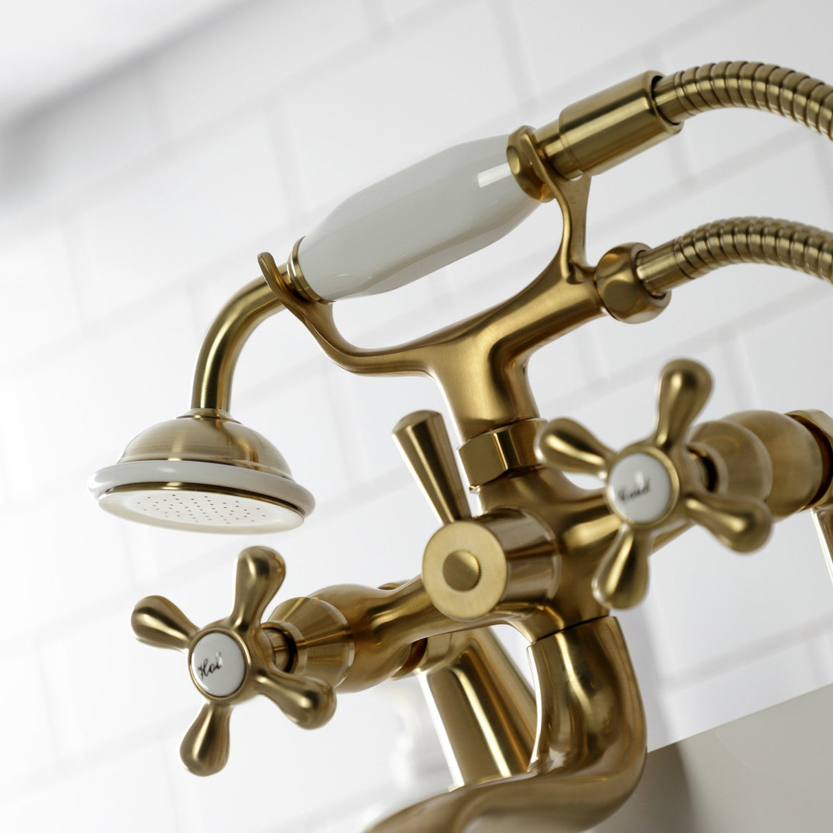 Kingston KS227SB Three-Handle 2-Hole Deck Mount Clawfoot Tub Faucet with Handshower, Brushed Brass