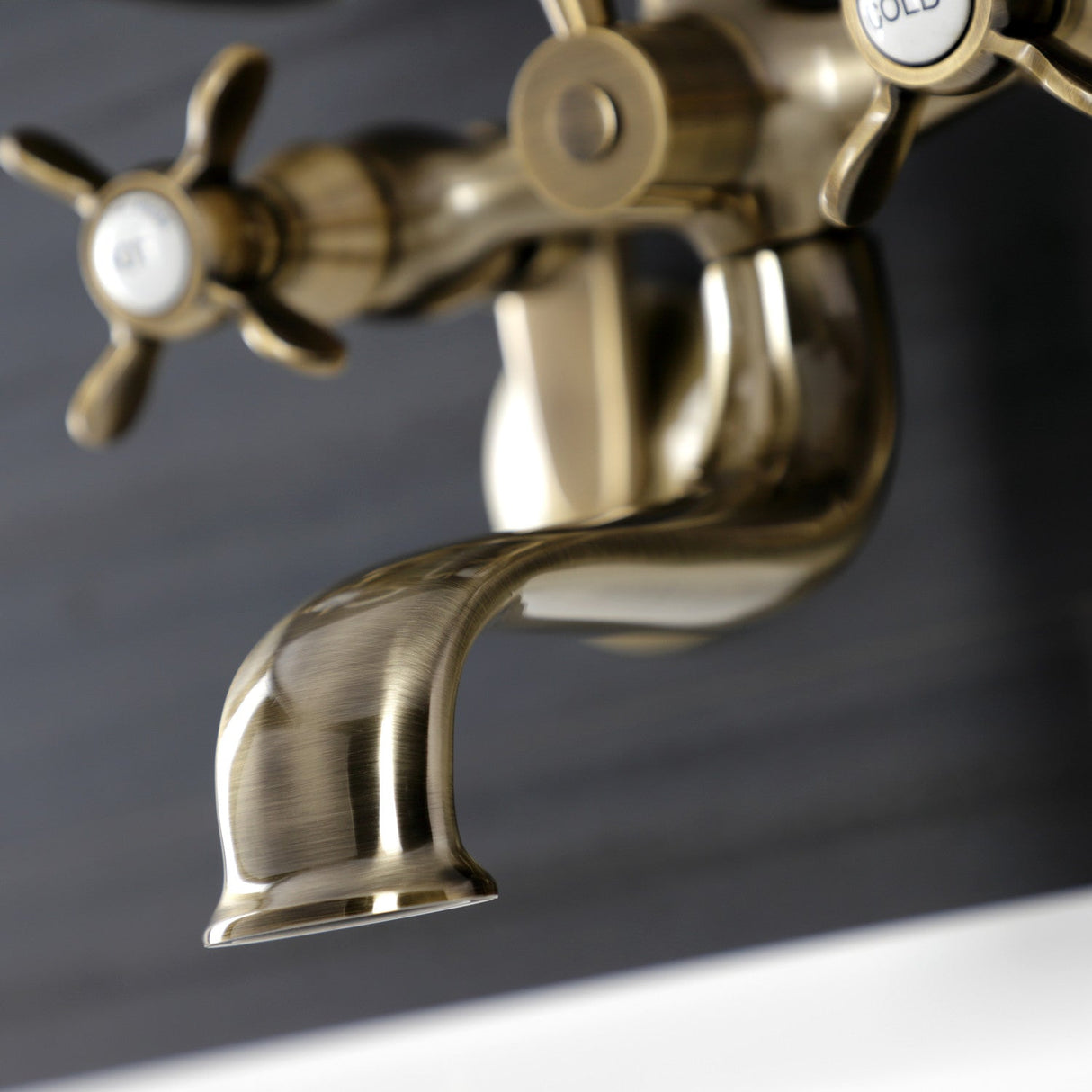 Essex KS246AB Three-Handle 2-Hole Wall Mount Clawfoot Tub Faucet with Handshower, Antique Brass