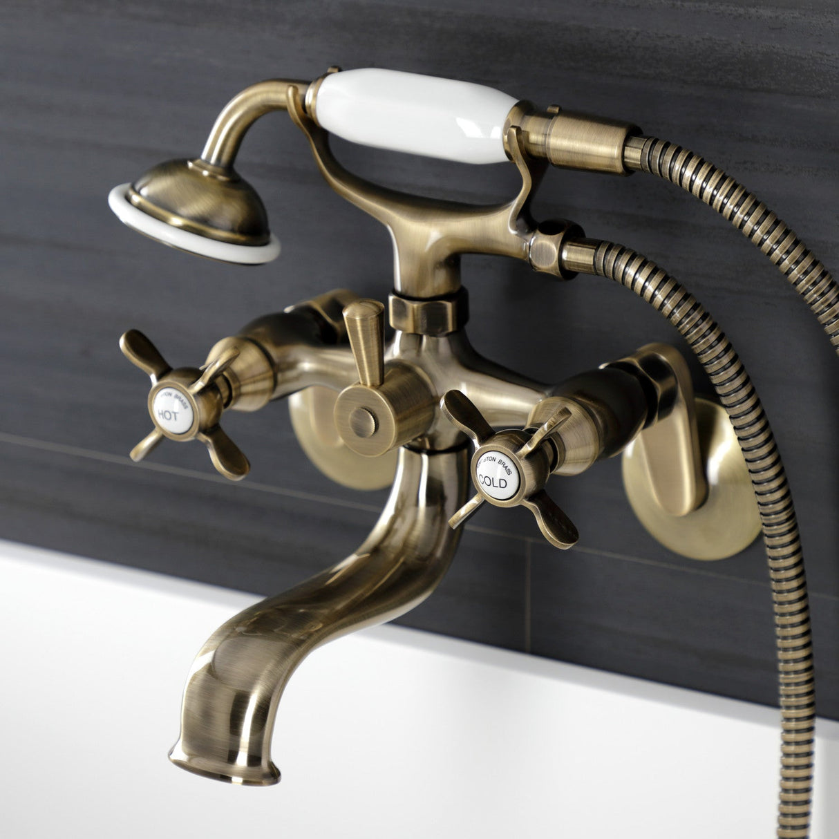 Essex KS246AB Three-Handle 2-Hole Wall Mount Clawfoot Tub Faucet with Handshower, Antique Brass