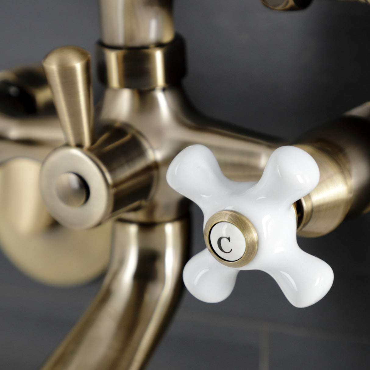 Kingston KS266PXAB Three-Handle 2-Hole Wall Mount Clawfoot Tub Faucet with Hand Shower, Antique Brass