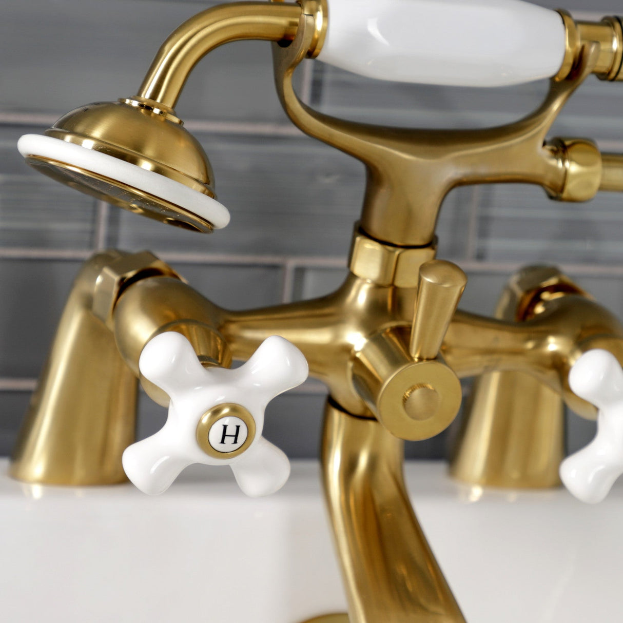 Kingston KS267PXSB Three-Handle 2-Hole Deck Mount Clawfoot Tub Faucet with Hand Shower, Brushed Brass