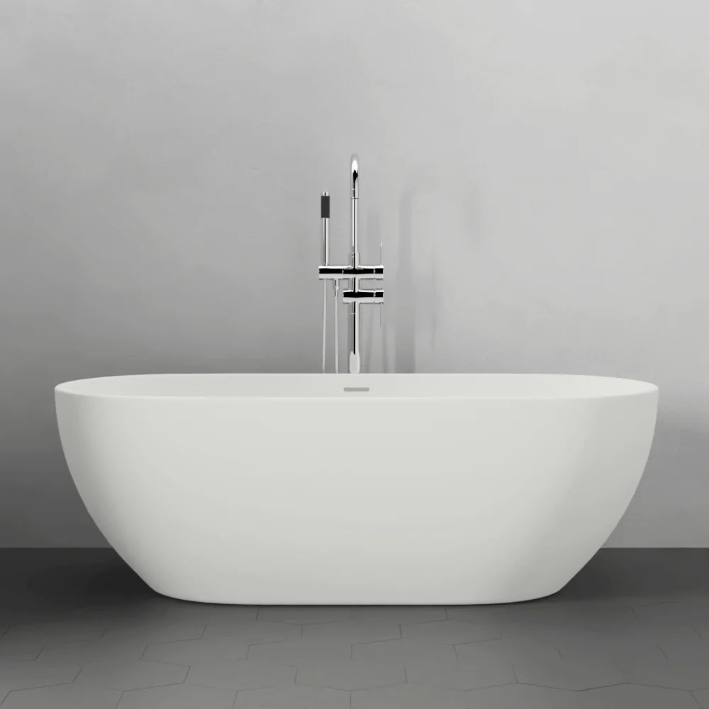 White freestanding bathtub against a gray wall