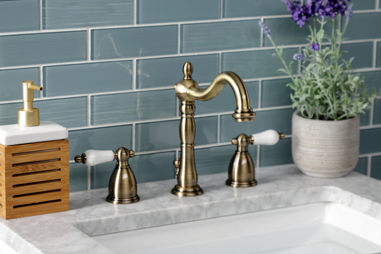 Kingston Brass KB1973PL Heritage Widespread Bathroom Faucet with Brass Pop-Up, Antique Brass