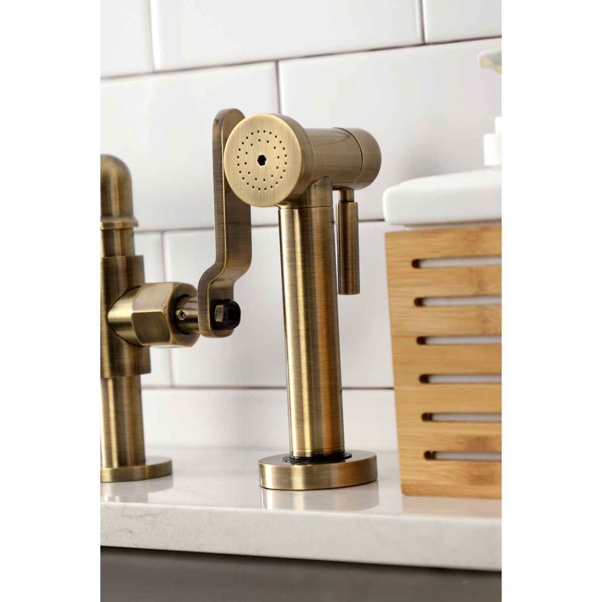 Kingston Brass KS2333KL Whitaker Industrial Style Bridge Kitchen Faucet with Brass Sprayer, Antique Brass