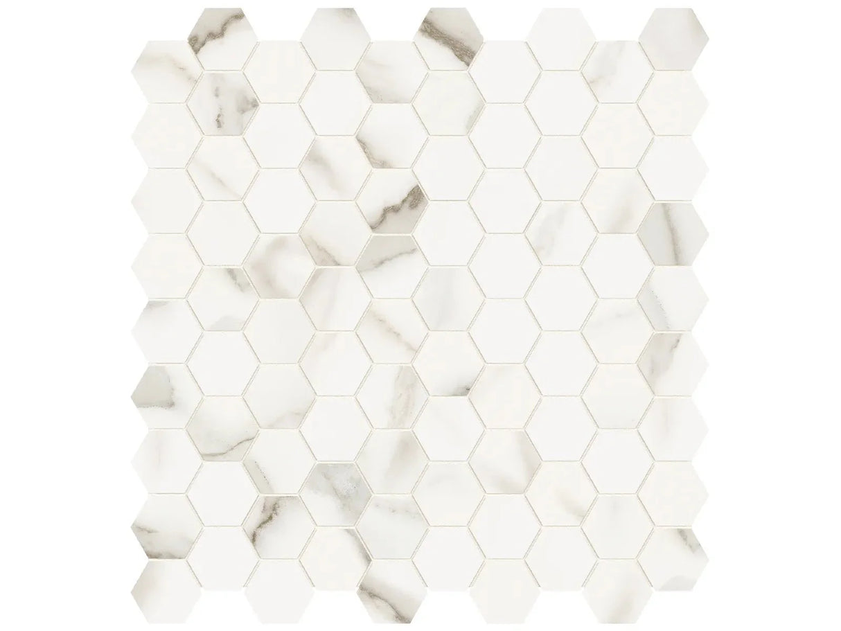 Anatolia Tile 1.25 Inch Mayfair Calacatta Polished Porcelain Hexagon Mosaics. 1 Sheet = .97 Sq. Ft. 4501-0146-1 Calacatta Oro 1.25" Hexagon - premium natural stone mosaic tile from Anatolia Tile, available at PoshHaus showroom in Keene, NH
