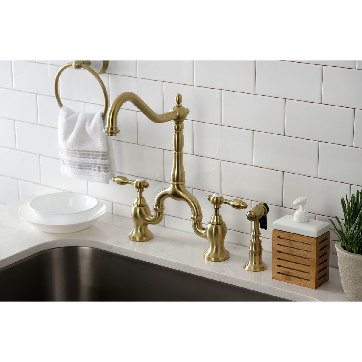 Kingston Brass KS7757TALBS Tudor Bridge Kitchen Faucet with Brass Sprayer, Brushed Brass