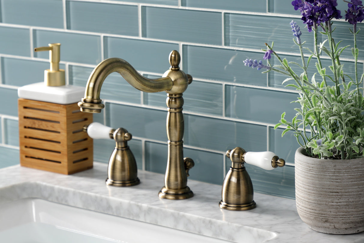 Kingston Brass KB1973PL Heritage Widespread Bathroom Faucet with Brass Pop-Up, Antique Brass
