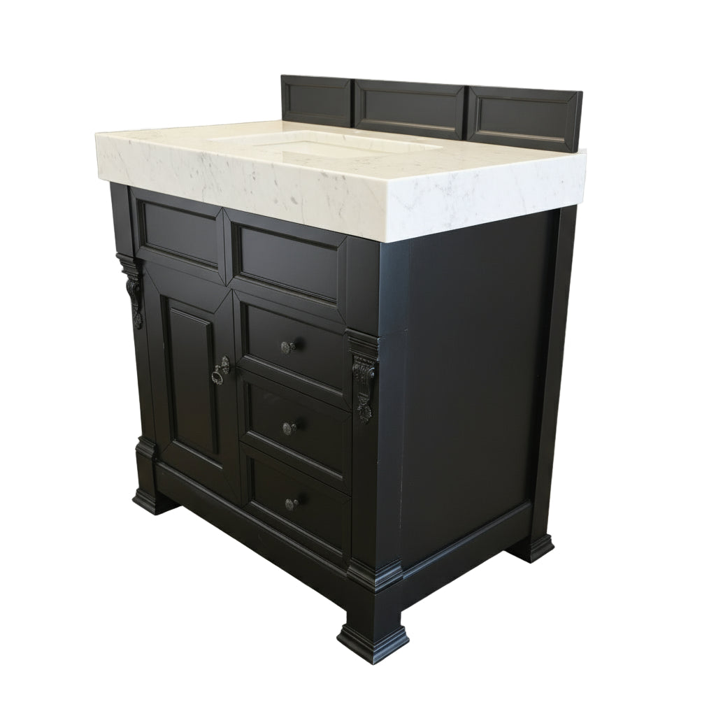 Black cabinet with silver handles mounted on a wooden wall.