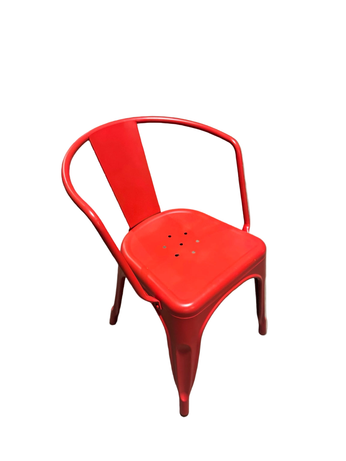 Red metal chair in a warehouse setting with cardboard boxes and equipment in the background.