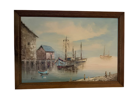 Framed painting of a harbor scene with boats and buildings.