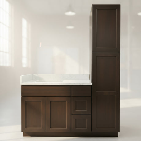 Bathroom vanity with dark wood cabinets and white countertop against a beige wall.