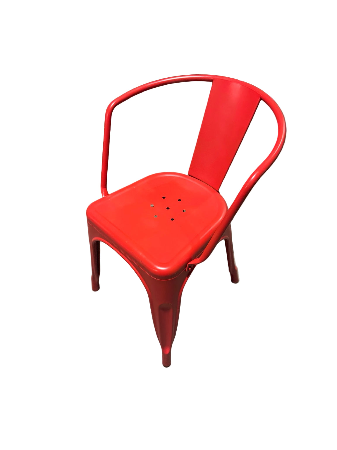 Red metal chair on a concrete floor with blurred background