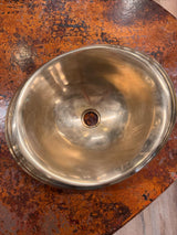 Metallic bowl on a rusted surface