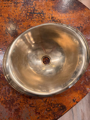 Metallic bowl on a rusted surface
