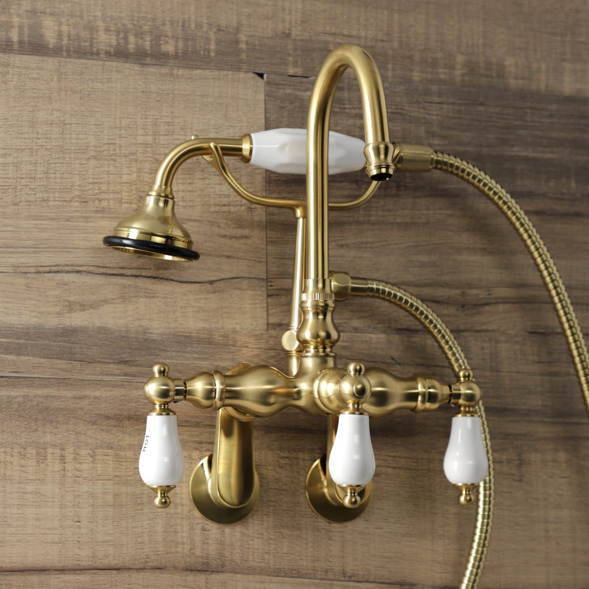 Aqua Vintage AE303T7 Three-Handle 2-Hole Tub Wall Mount Clawfoot Tub Faucet with Hand Shower, Brushed Brass