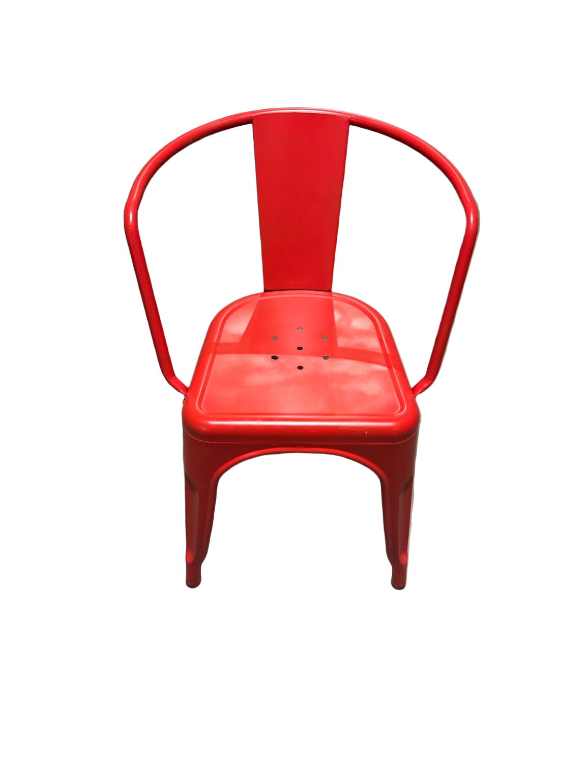 Red metal chair on a concrete floor