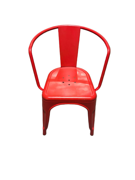 Red metal chair on a concrete floor