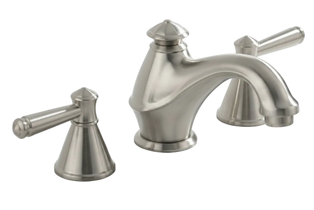 A three-hole bathroom faucet set with two matching lever handles, finished in brushed nickel, mounted on a white marble sink countertop against a white background.