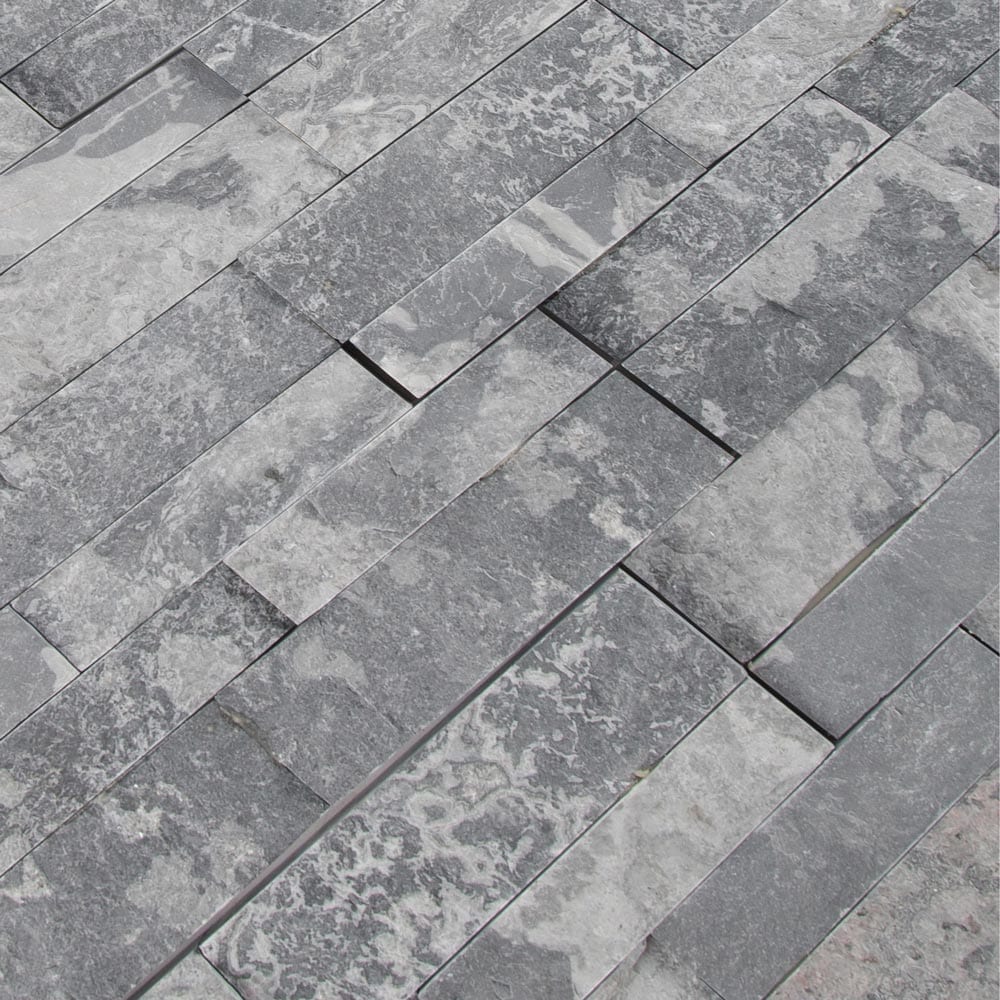 Glacial grey splitface ledger panel 6X24 natural marble wall tile LPNLMGLAGRY624 product shot multiple tiles angle view