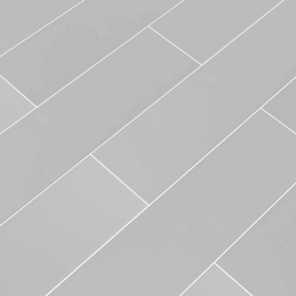 Gray glossy glazed ceramic wall tile msi collection NGRAGLO4X16 product shot multiple tiles angle view #Size_4"x16"