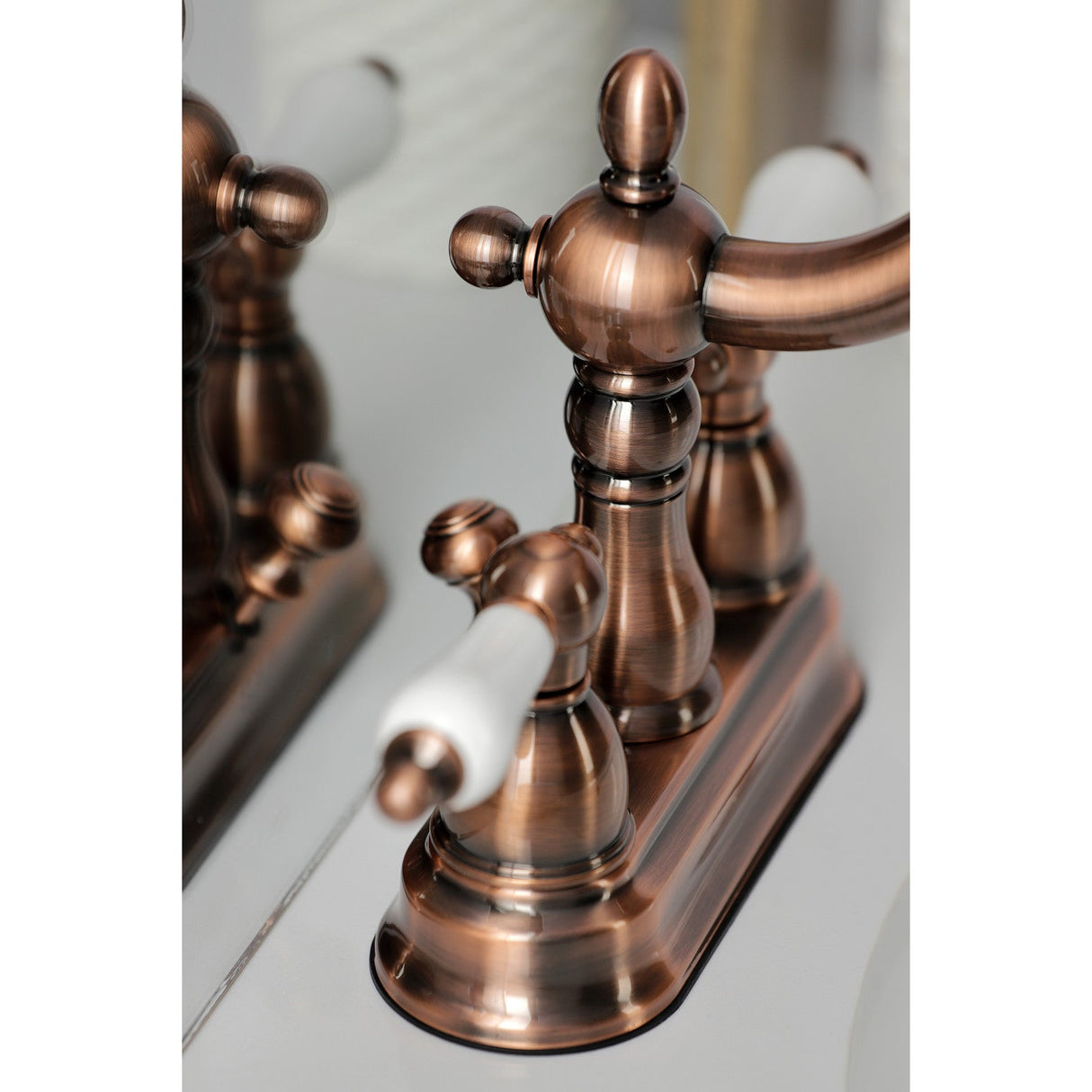 Heritage KB160PLAC Two-Handle 3-Hole Deck Mount 4" Centerset Bathroom Faucet with Plastic Pop-Up, Antique Copper