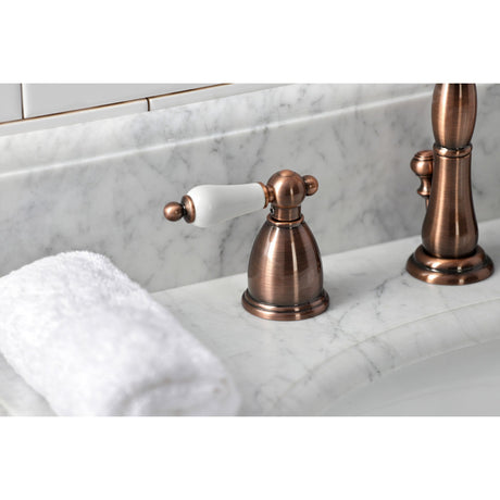 Heritage KB197PLAC Two-Handle 3-Hole Deck Mount Widespread Bathroom Faucet with Brass Pop-Up, Antique Copper