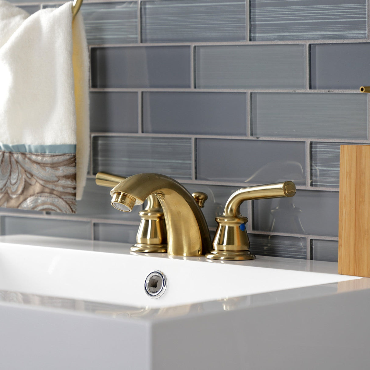 Restoration KB957RXLSB Two-Handle 3-Hole Deck Mount Mini-Widespread Bathroom Faucet with Plastic Pop-Up, Brushed Brass