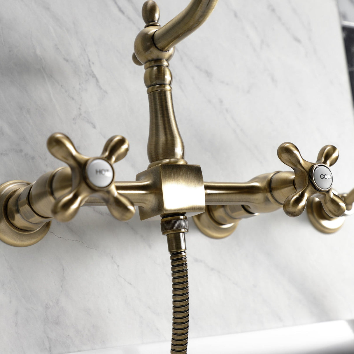 Heritage KS1243AXBS Two-Handle 2-Hole Wall Mount Bridge Kitchen Faucet with Brass Sprayer, Antique Brass