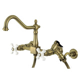 Heritage KS1243PXBS Two-Handle 2-Hole Wall Mount Bridge Kitchen Faucet with Brass Sprayer, Antique Brass