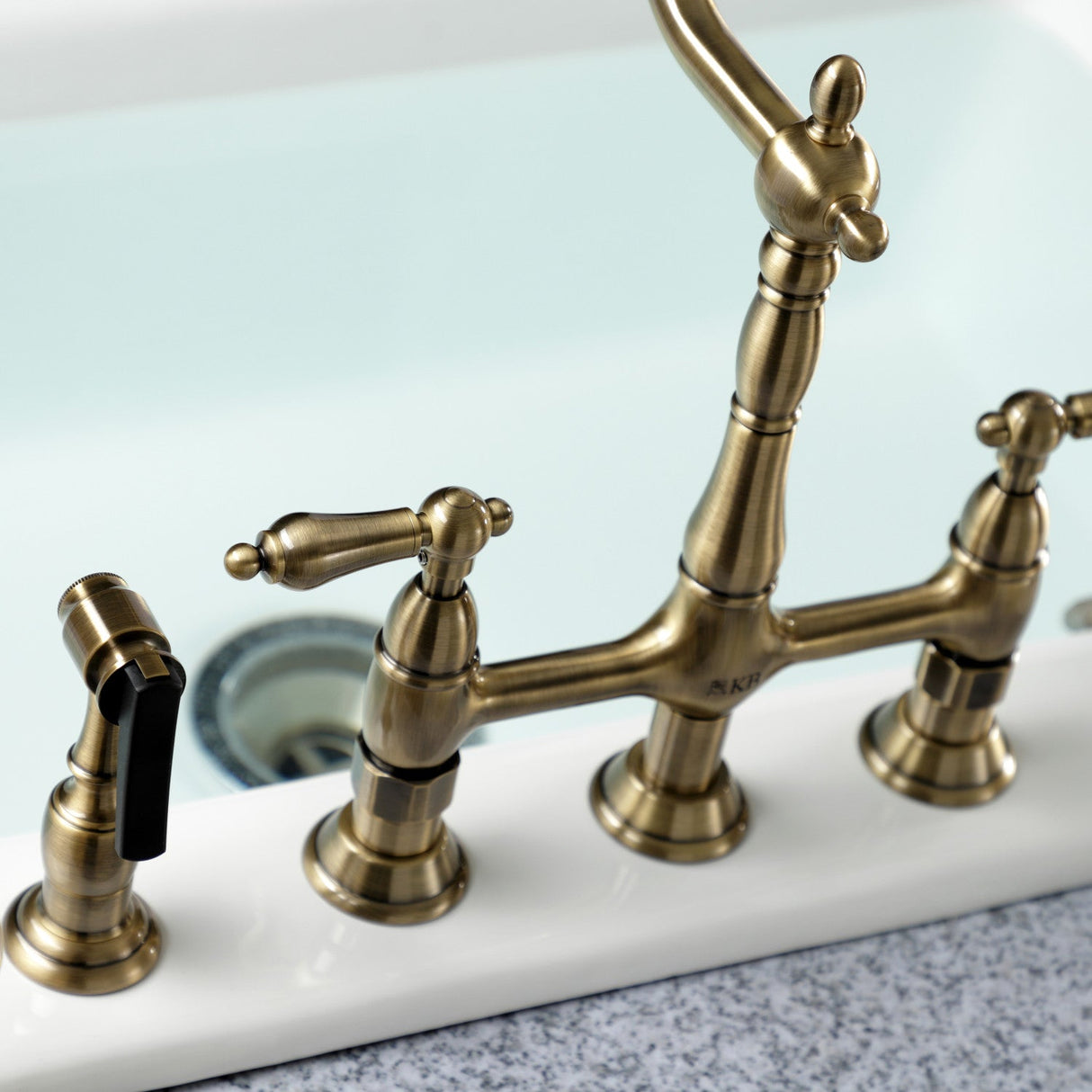 Heritage KS1273ALBS Two-Handle 4-Hole Deck Mount Bridge Kitchen Faucet with Brass Sprayer, Antique Brass