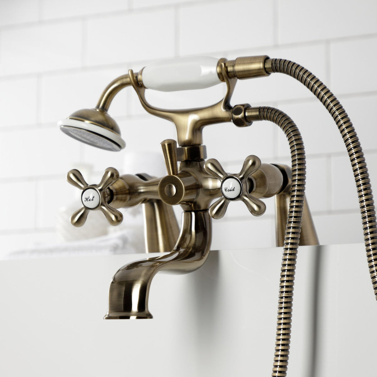 Kingston KS227AB Three-Handle 2-Hole Deck Mount Clawfoot Tub Faucet with Handshower, Antique Brass