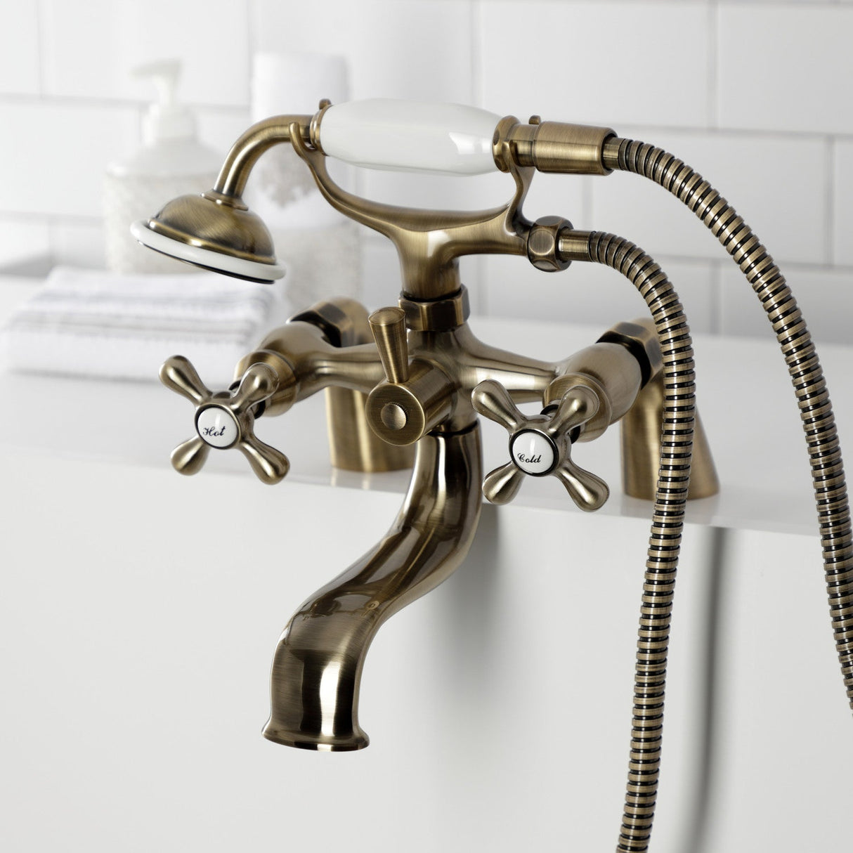 Kingston KS227AB Three-Handle 2-Hole Deck Mount Clawfoot Tub Faucet with Handshower, Antique Brass