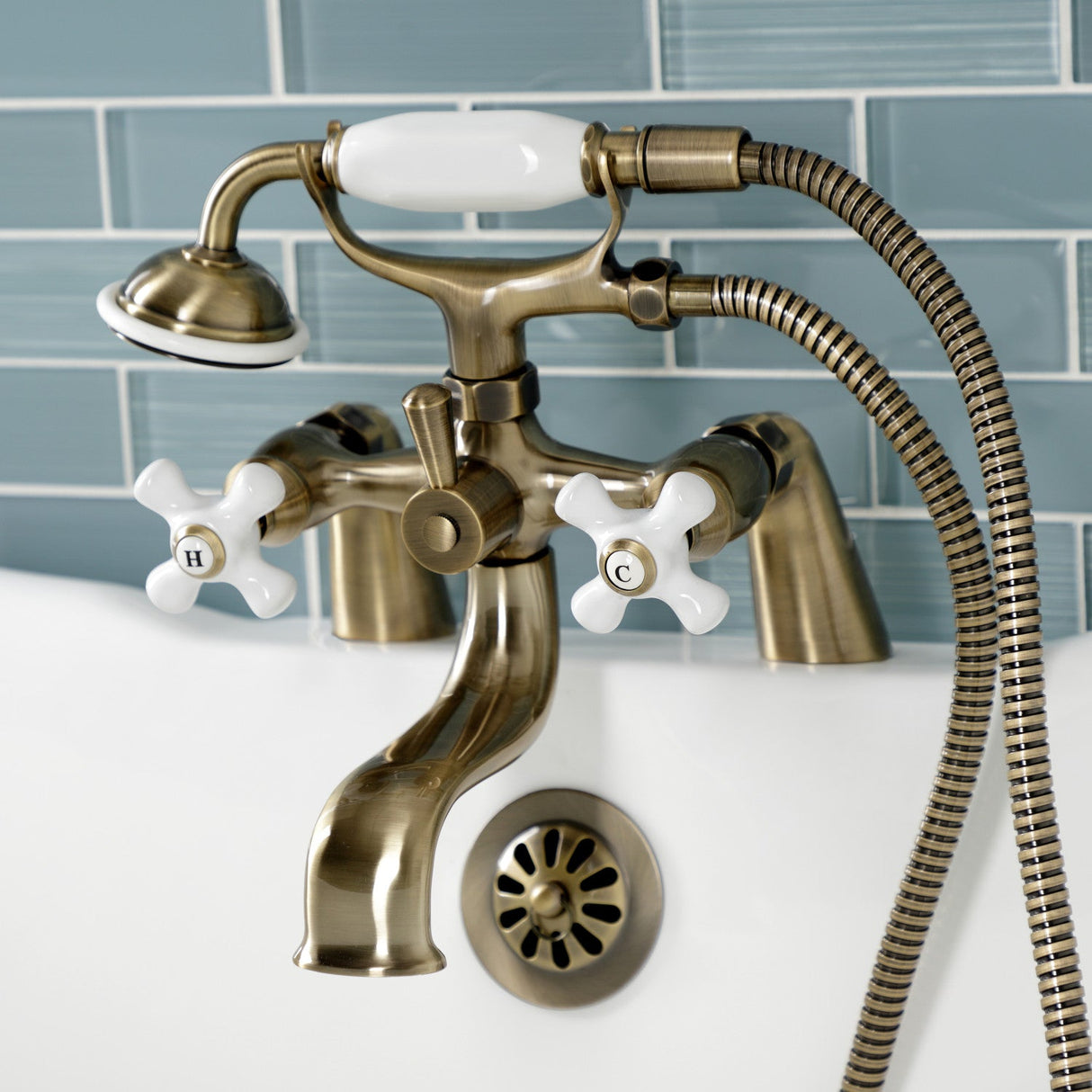 Kingston KS227PXAB Three-Handle 2-Hole Deck Mount Clawfoot Tub Faucet with Hand Shower, Antique Brass