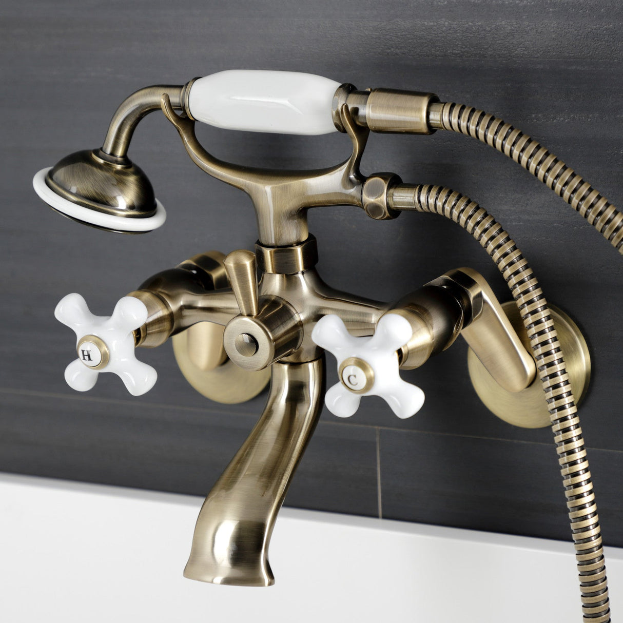 Kingston KS266PXAB Three-Handle 2-Hole Wall Mount Clawfoot Tub Faucet with Hand Shower, Antique Brass