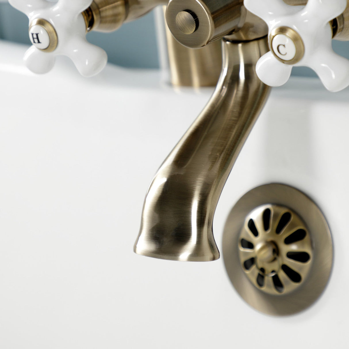 Kingston KS267PXAB Three-Handle 2-Hole Deck Mount Clawfoot Tub Faucet with Hand Shower, Antique Brass