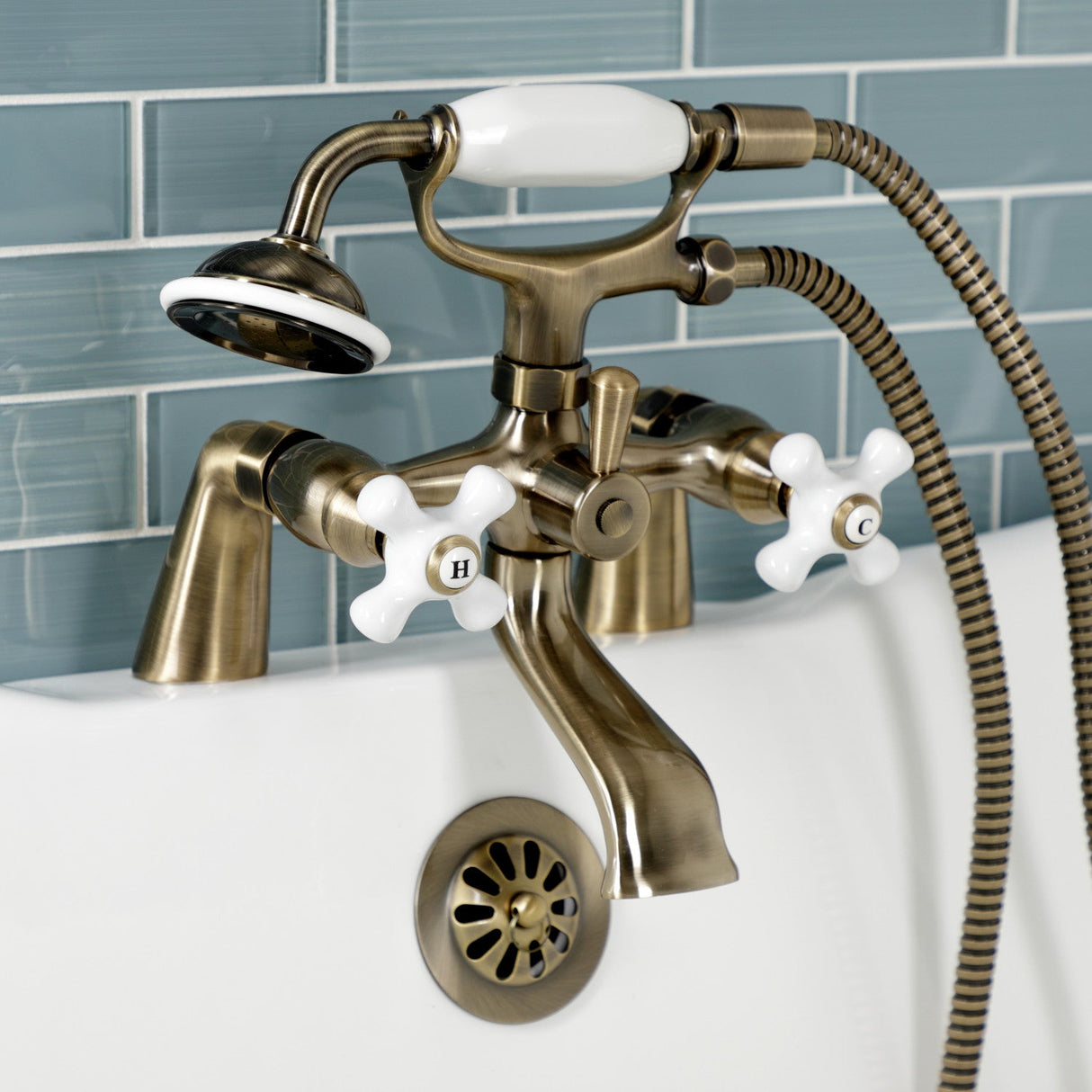 Kingston KS267PXAB Three-Handle 2-Hole Deck Mount Clawfoot Tub Faucet with Hand Shower, Antique Brass