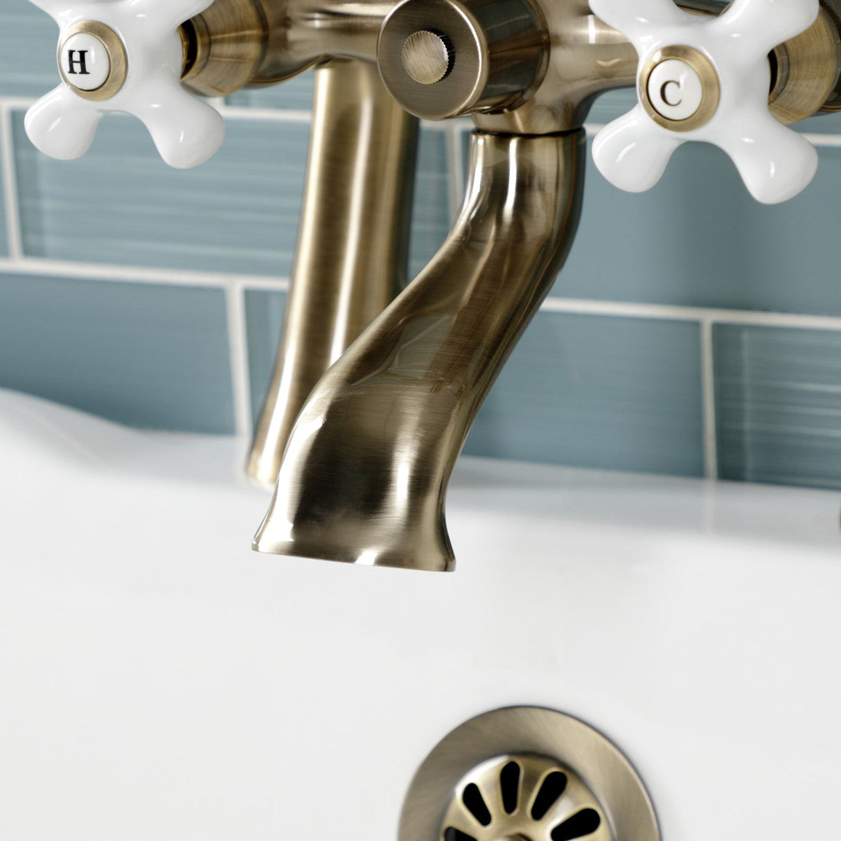 Kingston KS268PXAB Three-Handle 2-Hole Deck Mount Clawfoot Tub Faucet with Hand Shower, Antique Brass