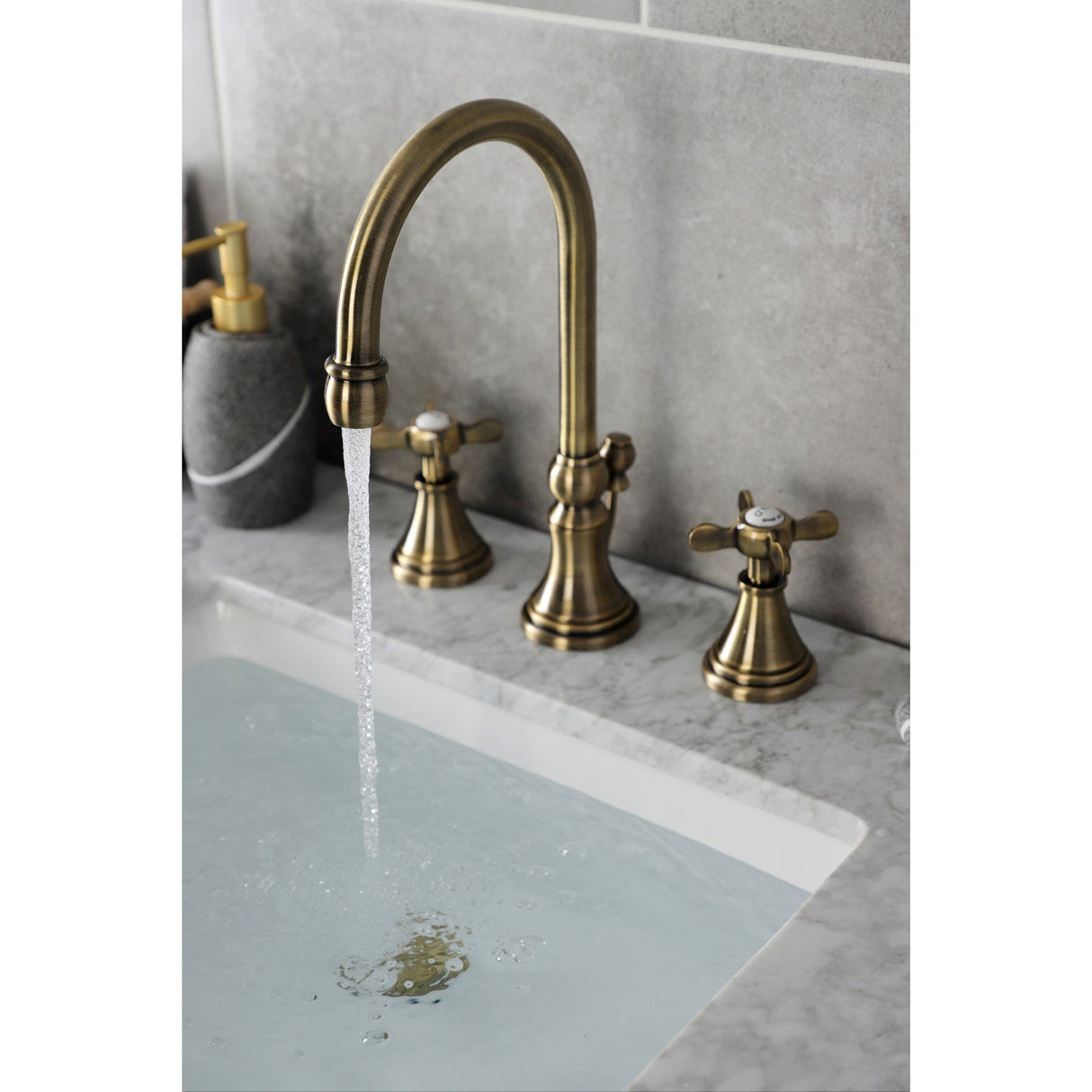 Essex KS2983BEX Two-Handle 3-Hole Deck Mount Widespread Bathroom Faucet with Brass Pop-Up, Antique Brass