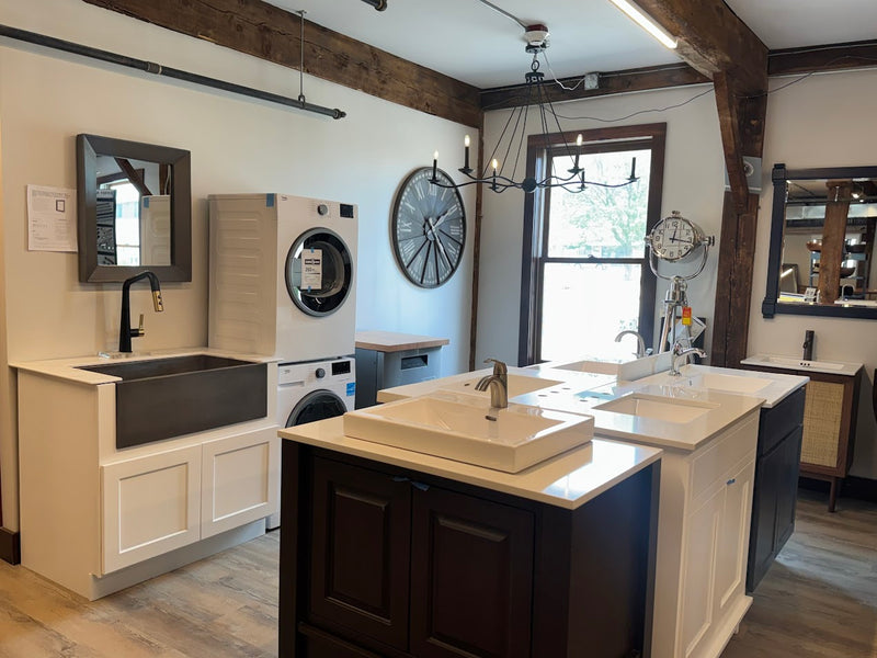 Modern kitchen with island, sink, and appliances in a home setting.

