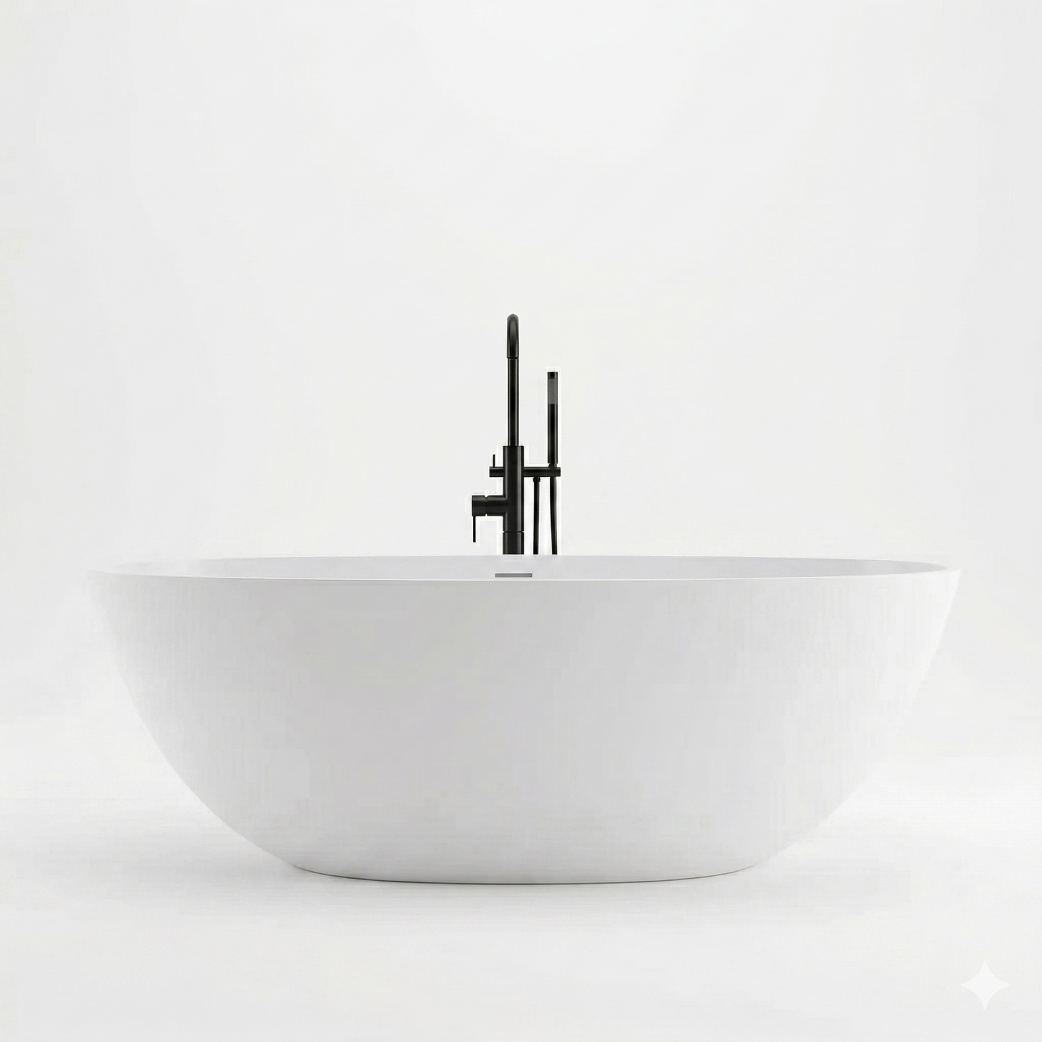 White freestanding bathtub with a black faucet on a white background