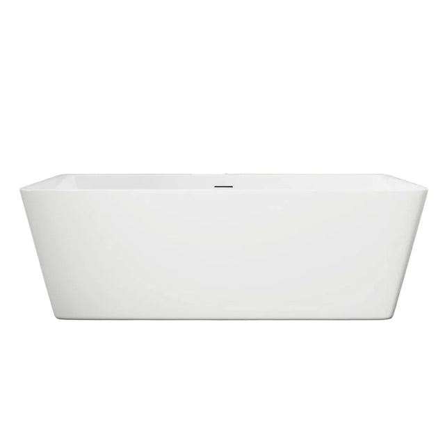 White freestanding bathtub against a gray wall